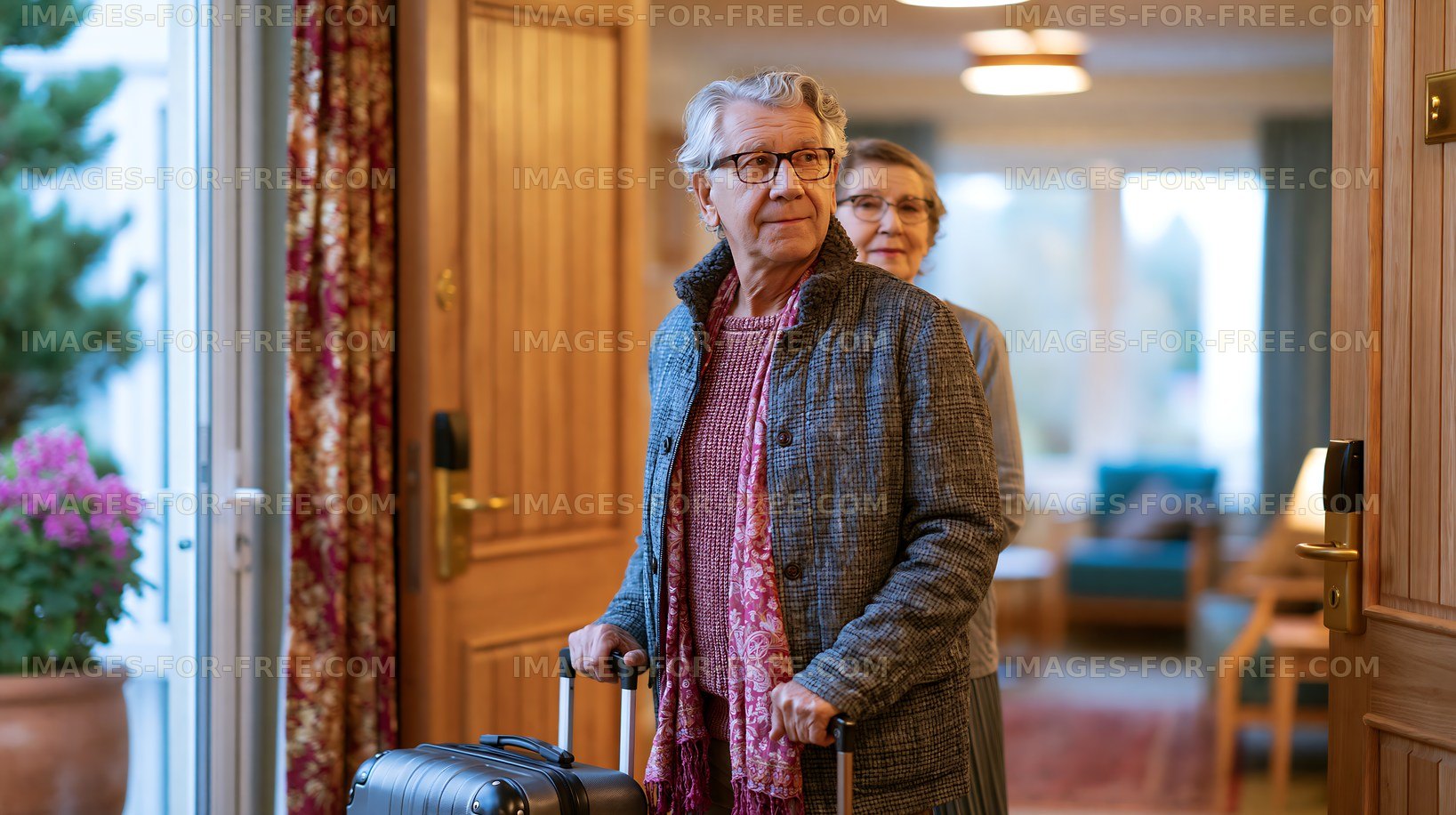 Elderly couple entering a home with luggage during daytime