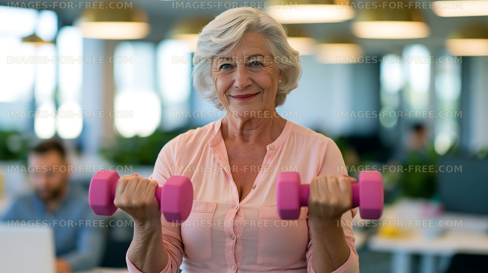 Senior woman exercising with dumbbells in an office setting