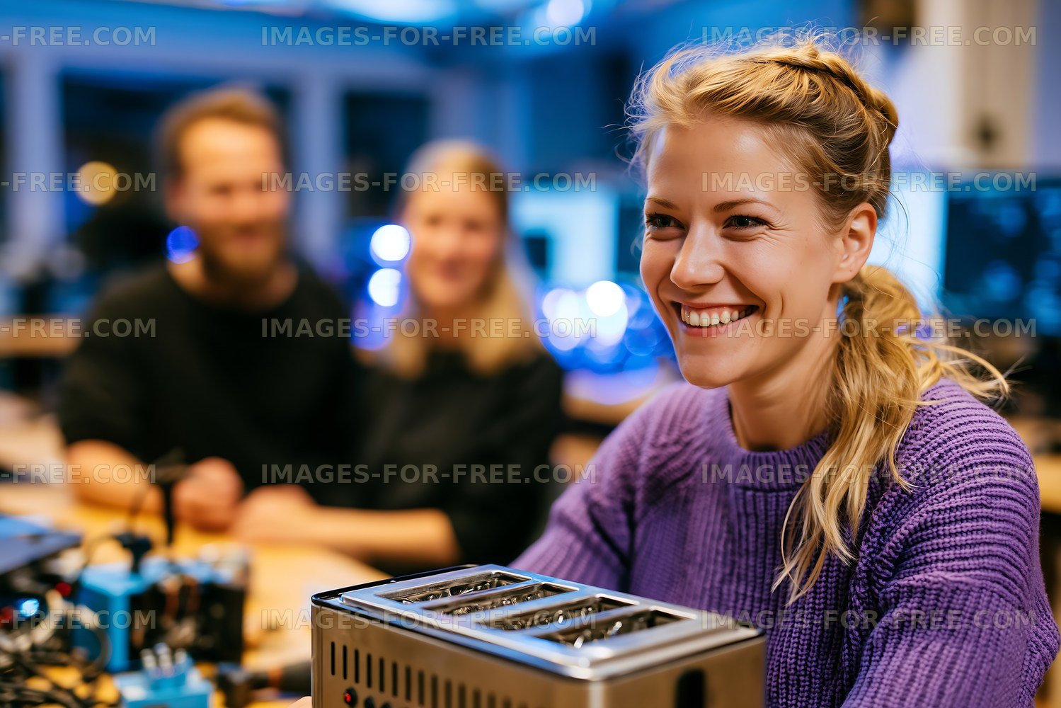 Group of friends working on a project in a workshop
