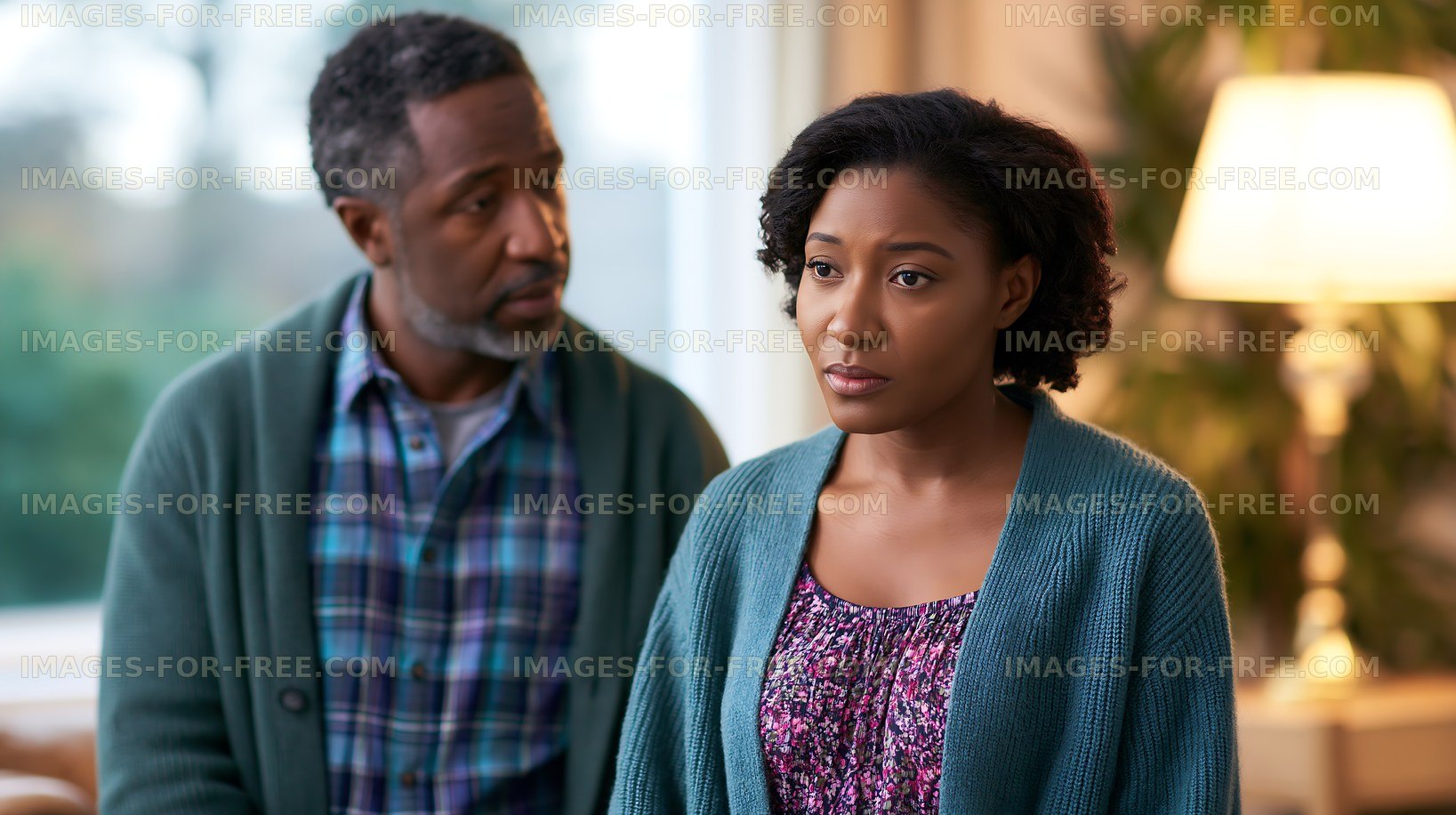 Conversation between two people in a living room setting