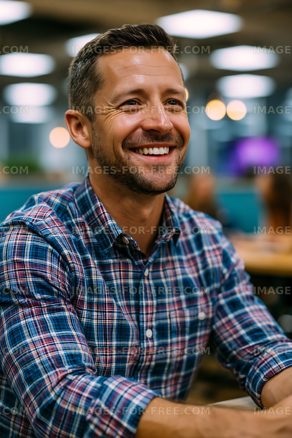 Man smiling in a casual setting during a gathering