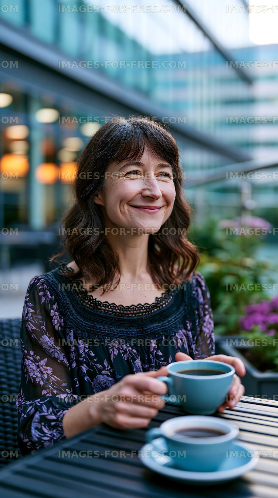 Woman enjoying coffee at a cafe with outdoor seating