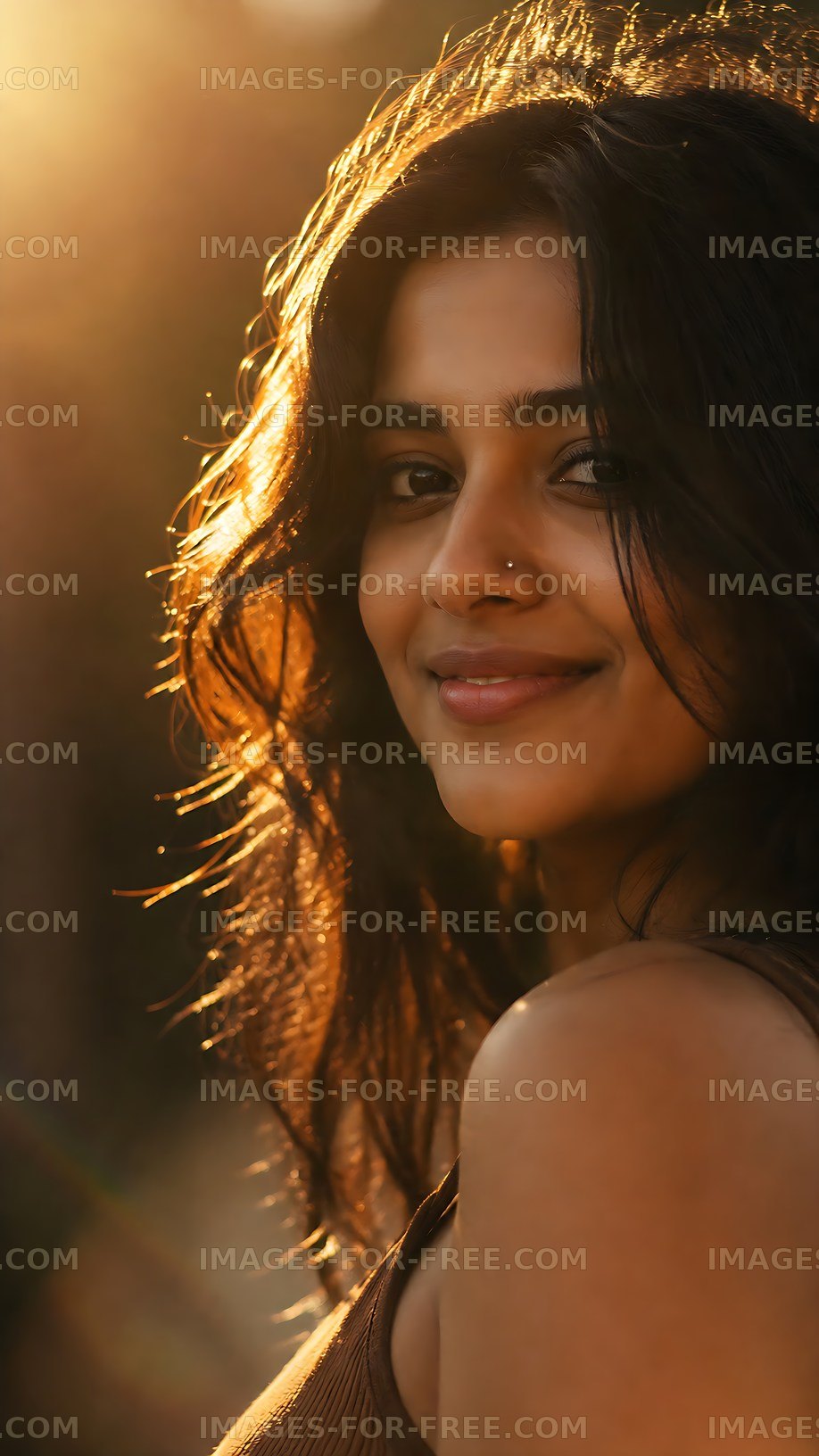 Woman smiling in sunlight with long hair