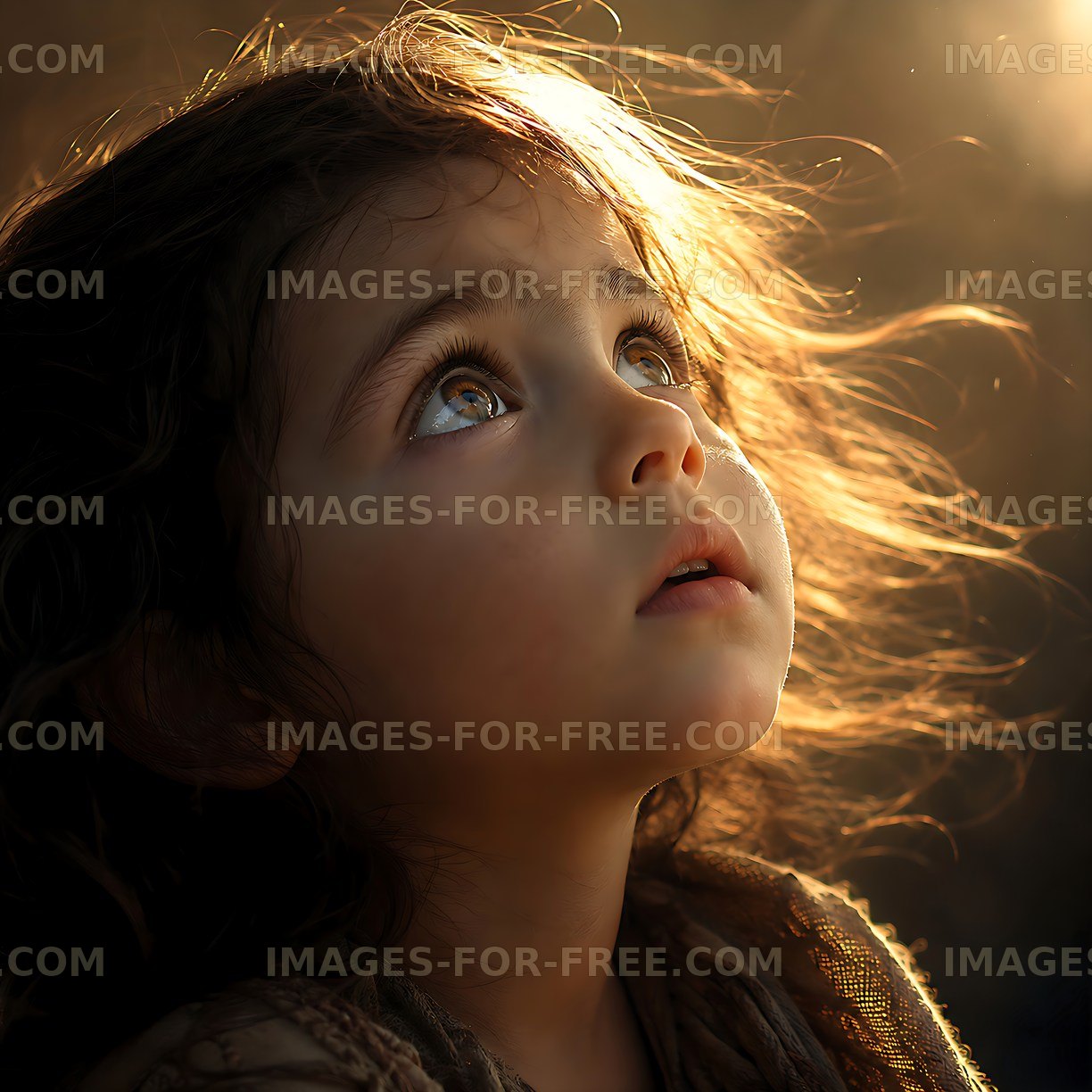 Child gazing upwards with sunlight illuminating her face