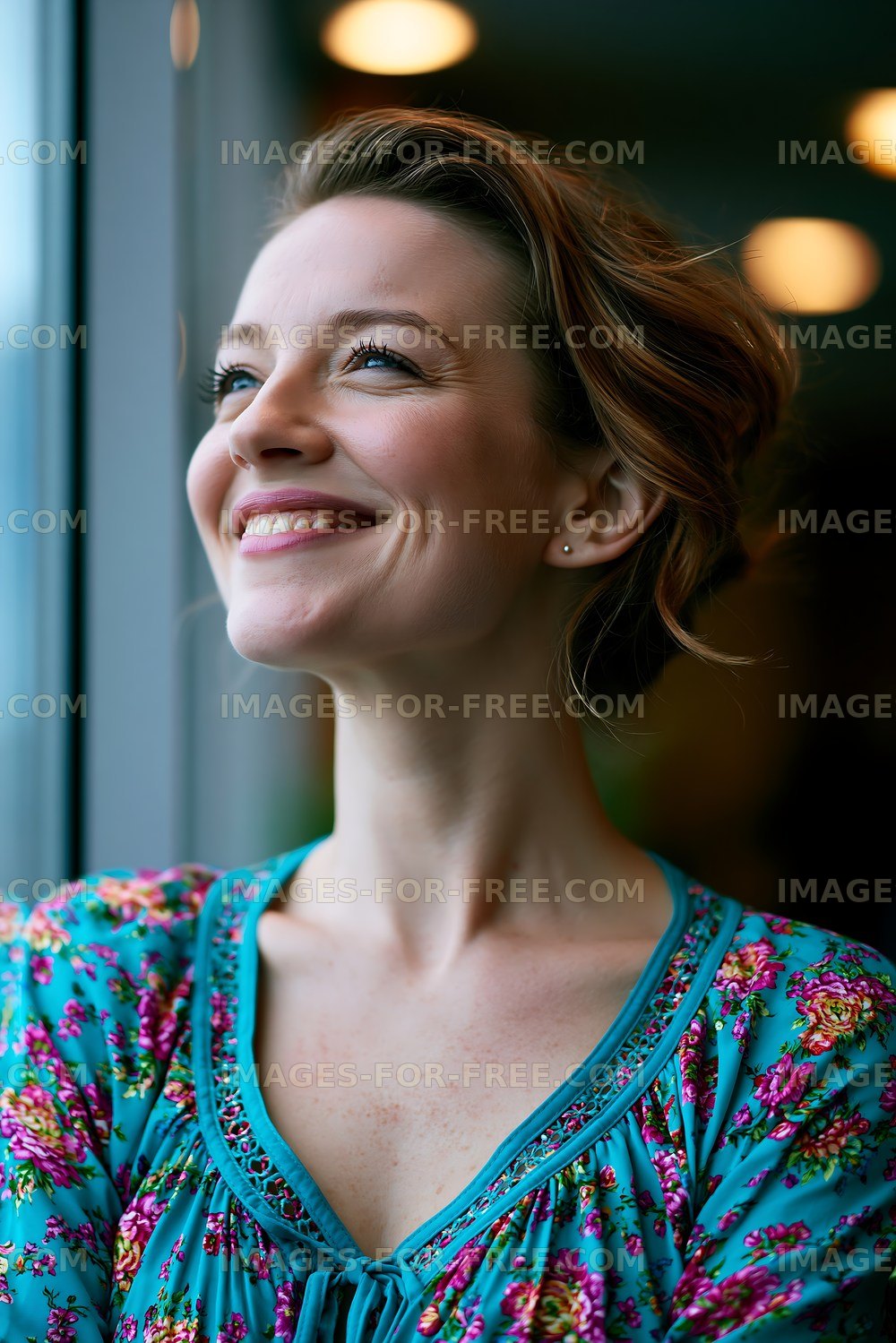 Woman looking out window with a smile