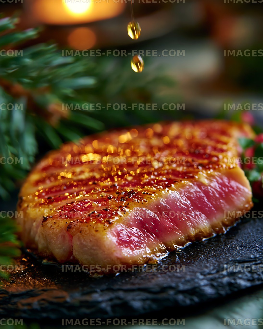 Juicy grilled steak slice on a dark plate with herbs