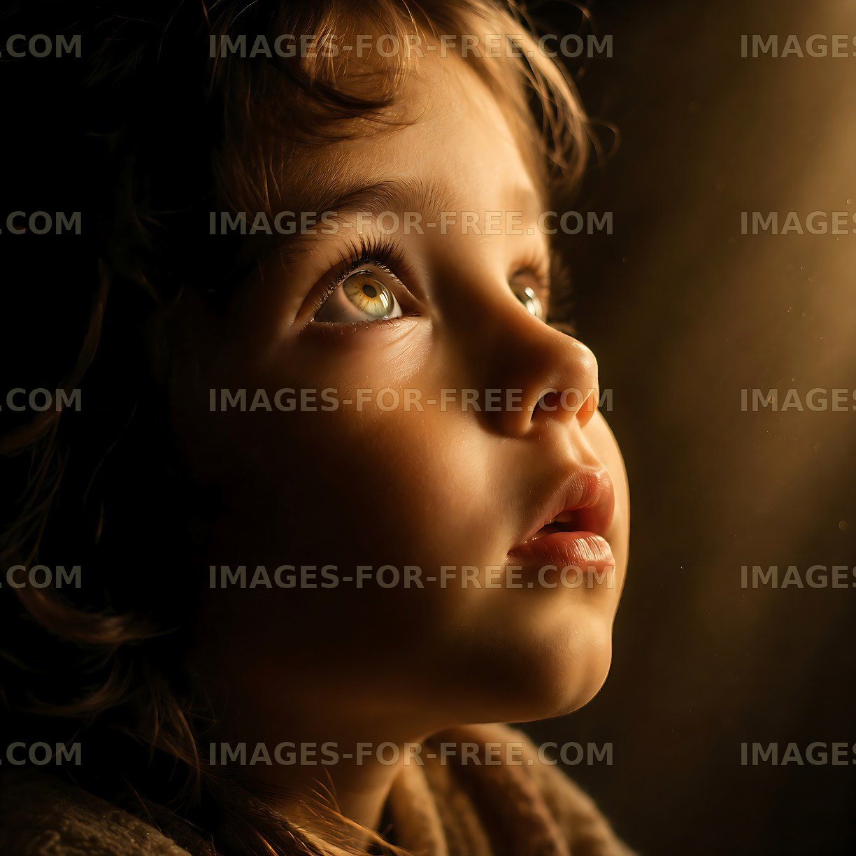 Child looking upwards with light illuminating the face
