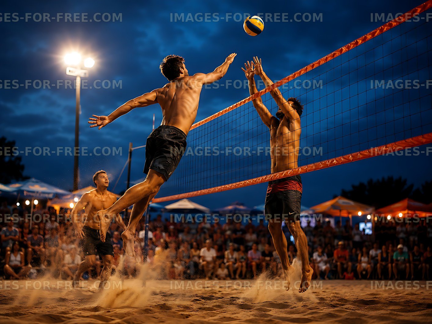 Beach volleyball match at sunset with players jumping