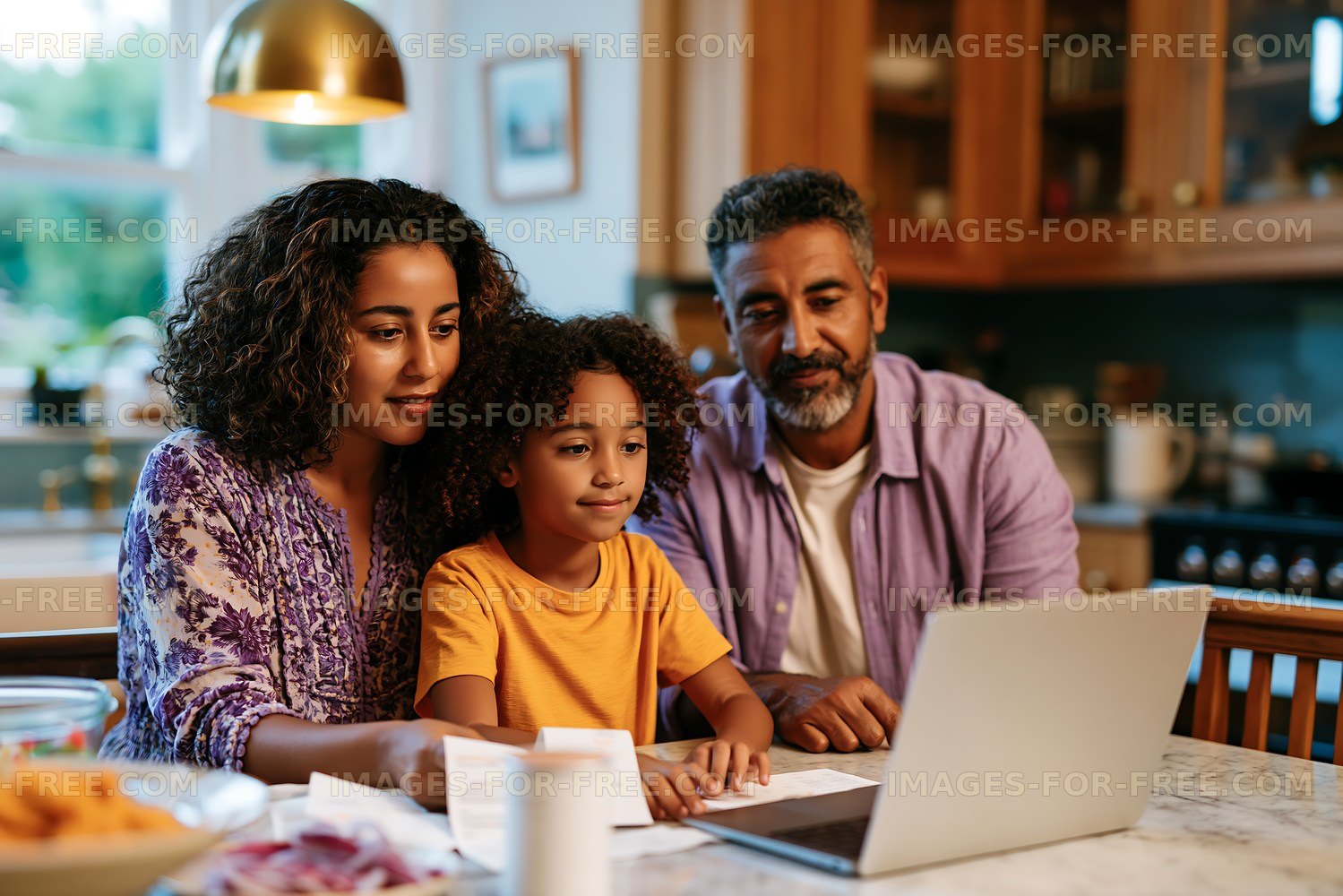 Family working together at home on a laptop