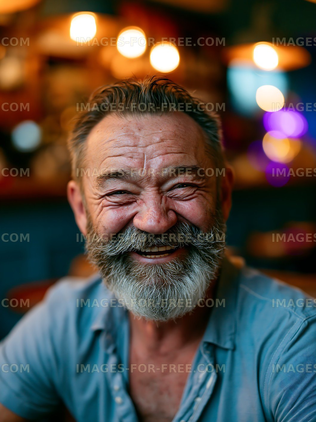 Smiling man with beard in casual setting