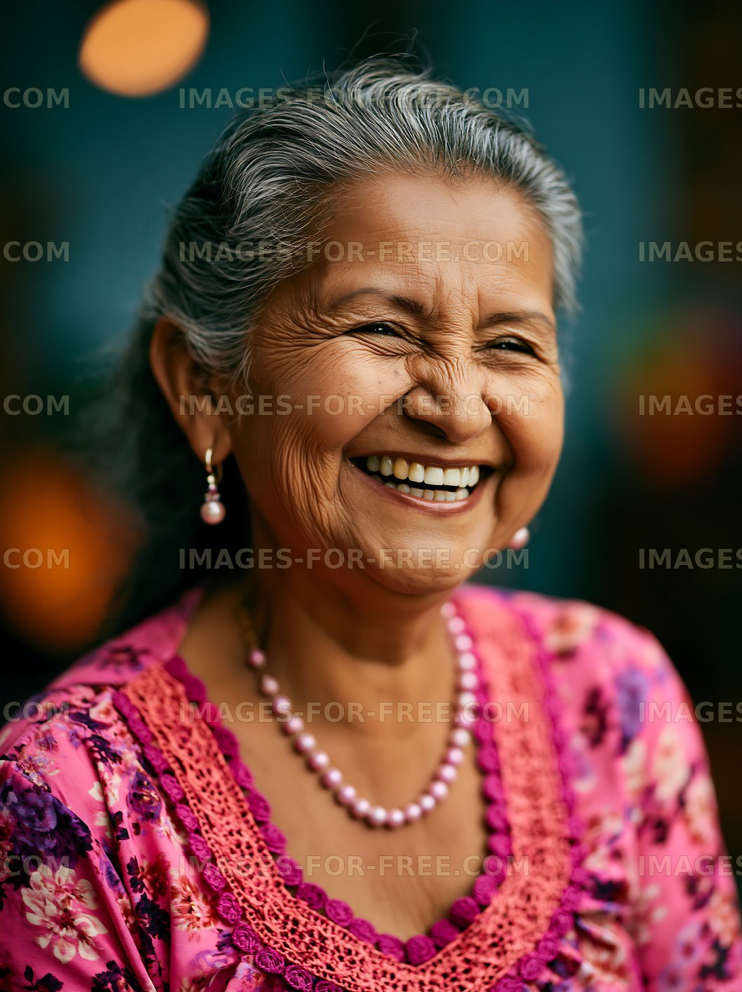 Smiling older woman in traditional attire with jewelry