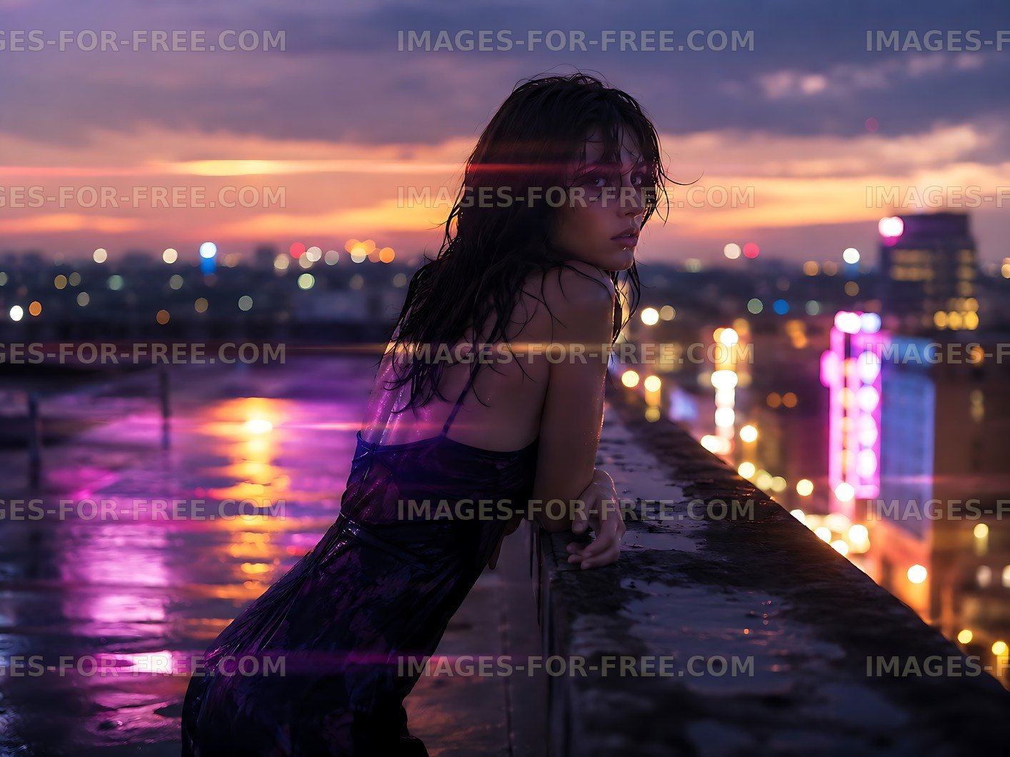 Woman on rooftop during sunset with city lights in background