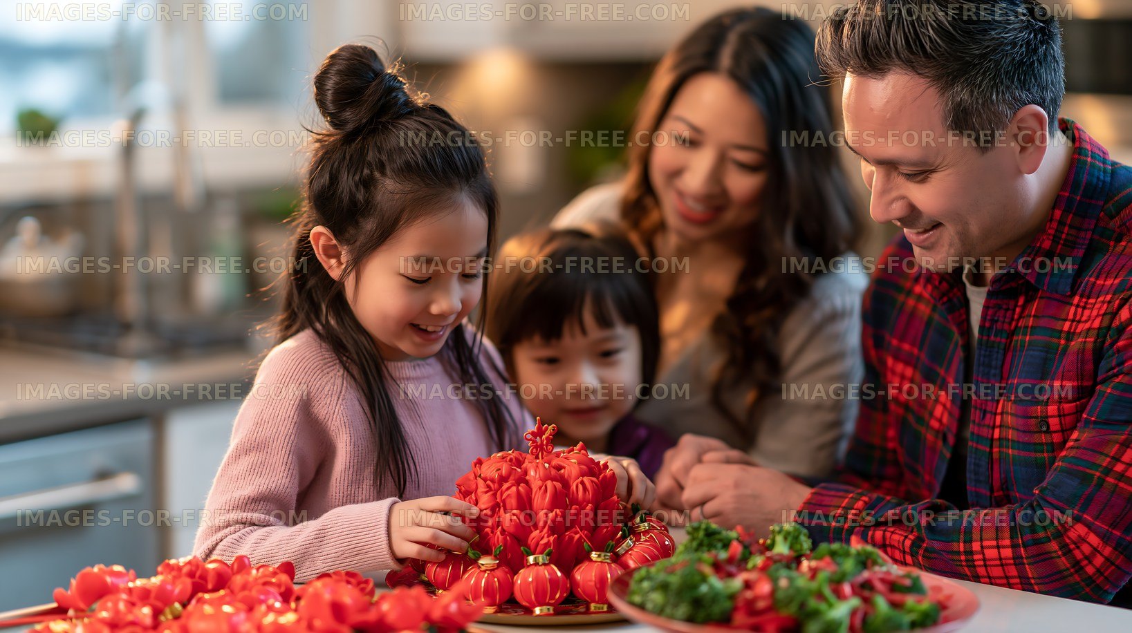 Family preparing food with small tomatoes in the kitchen