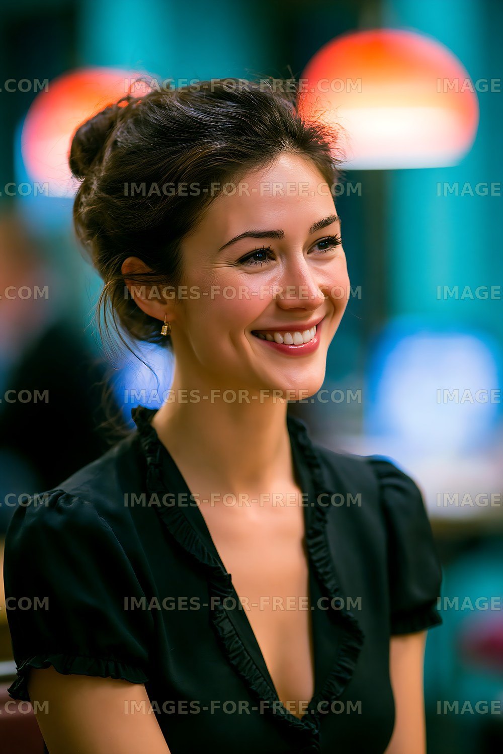 Smiling woman in black top sitting at cafe