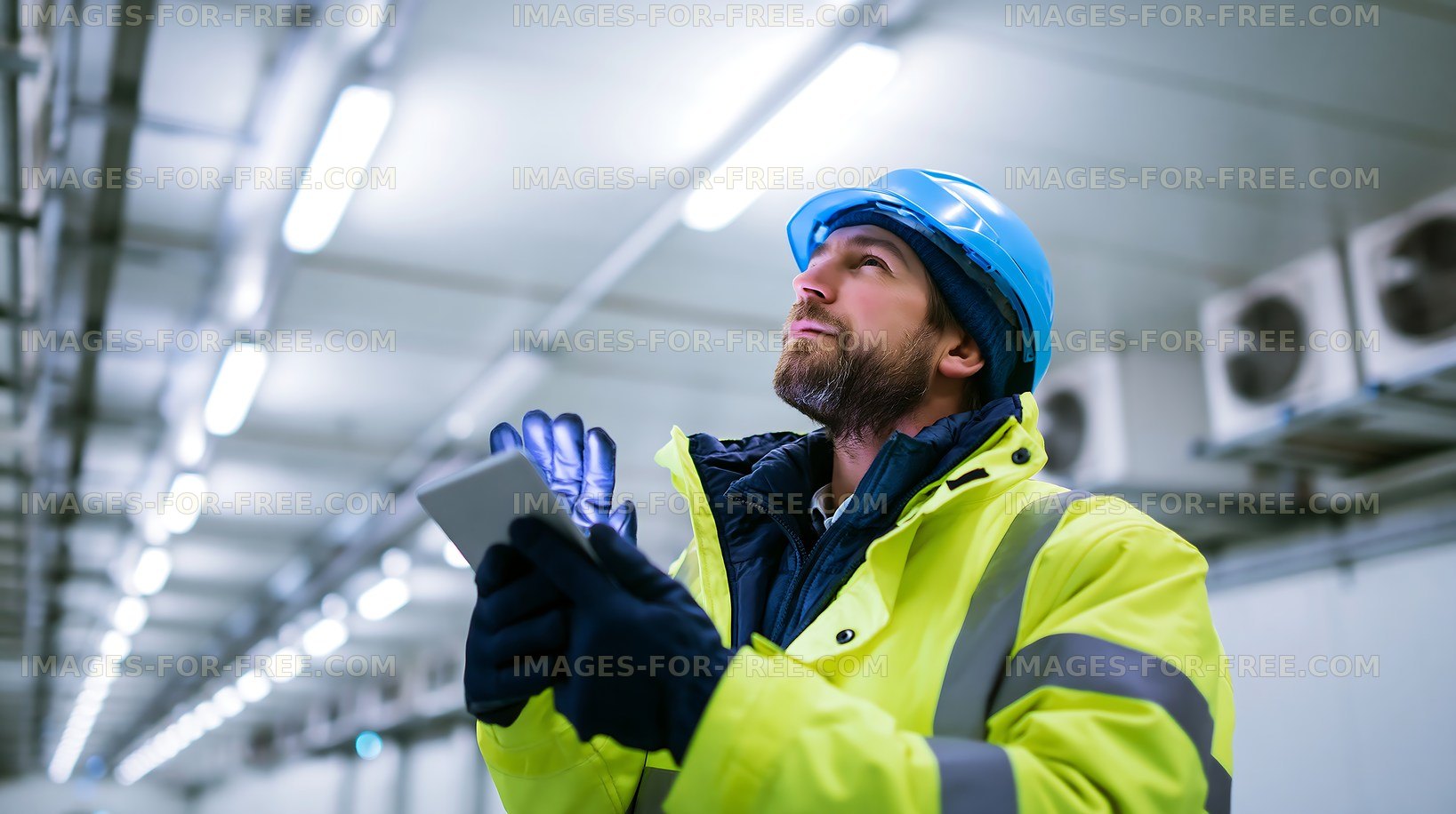 Construction worker checking equipment in industrial setting