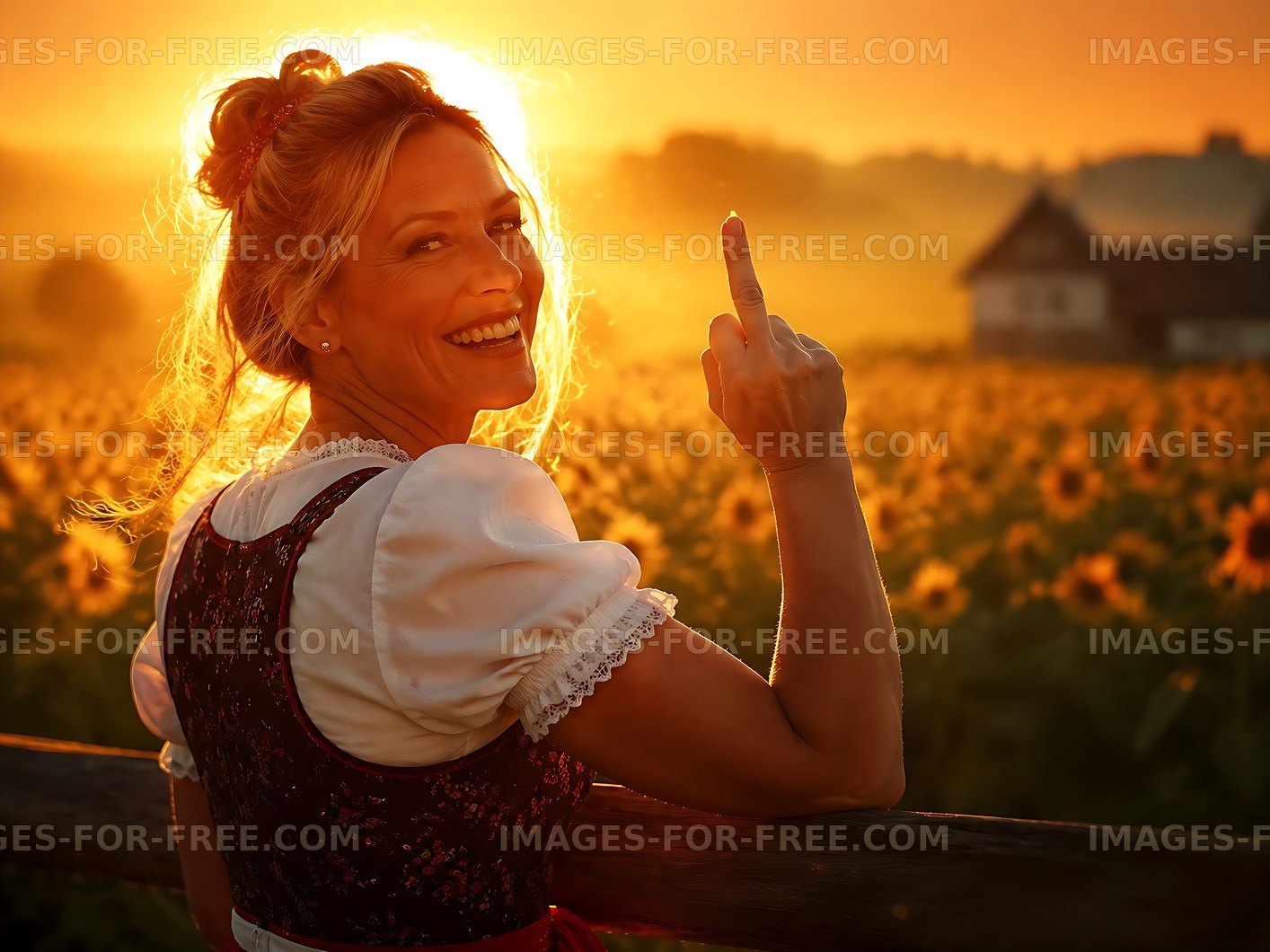 Woman in traditional dress smiles in sunflower field at sunset