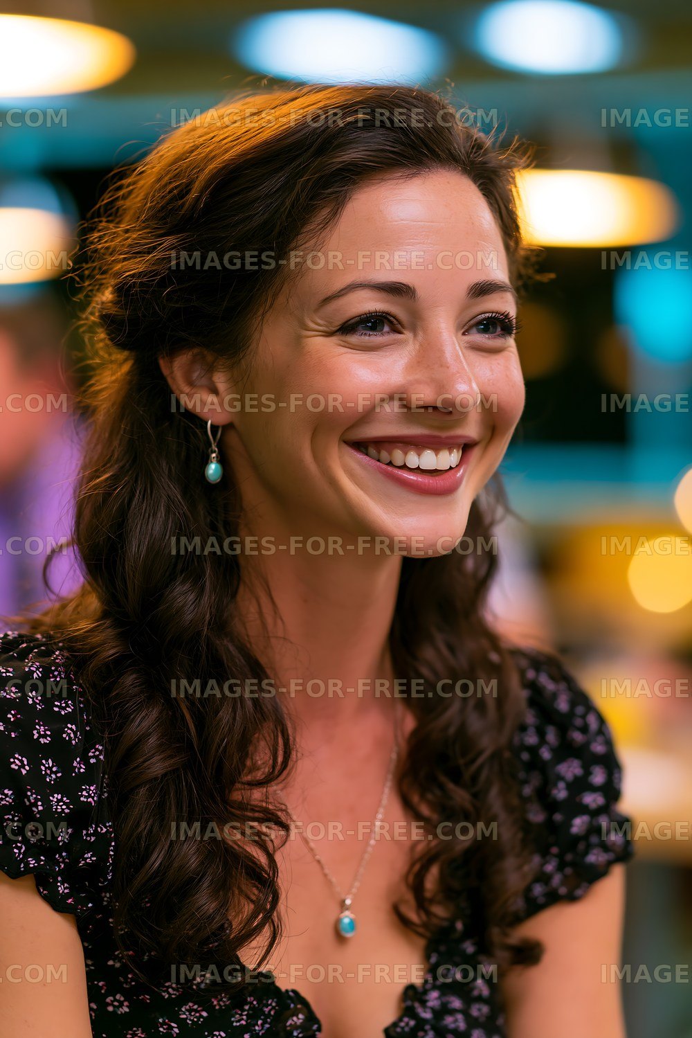 Woman smiling at social gathering inside a bar