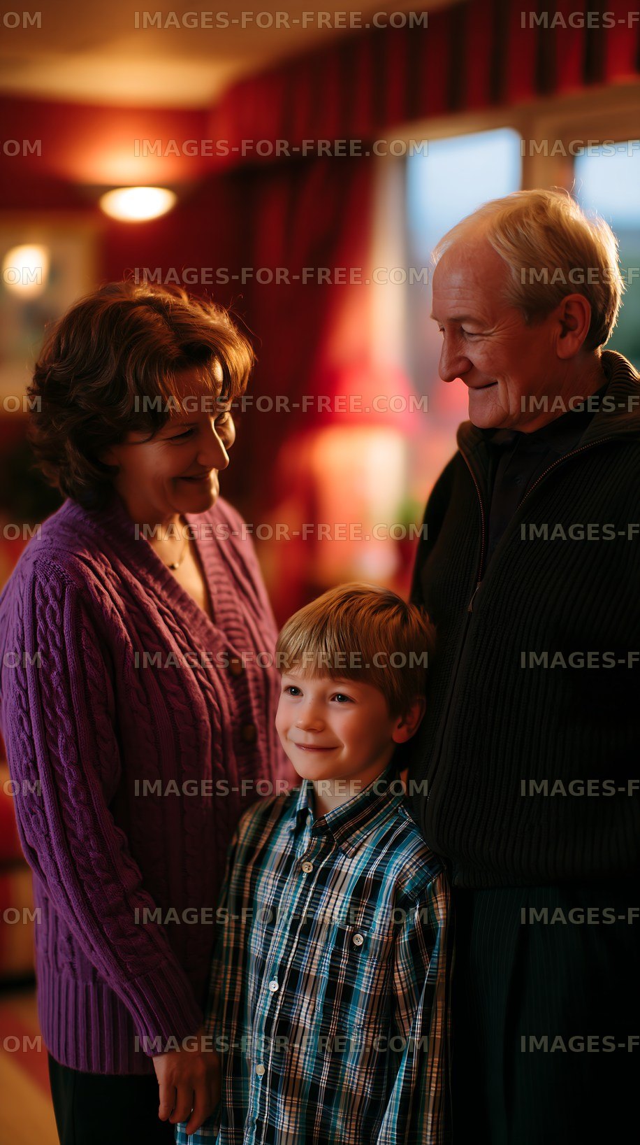 Family gathering at home with grandparents and child