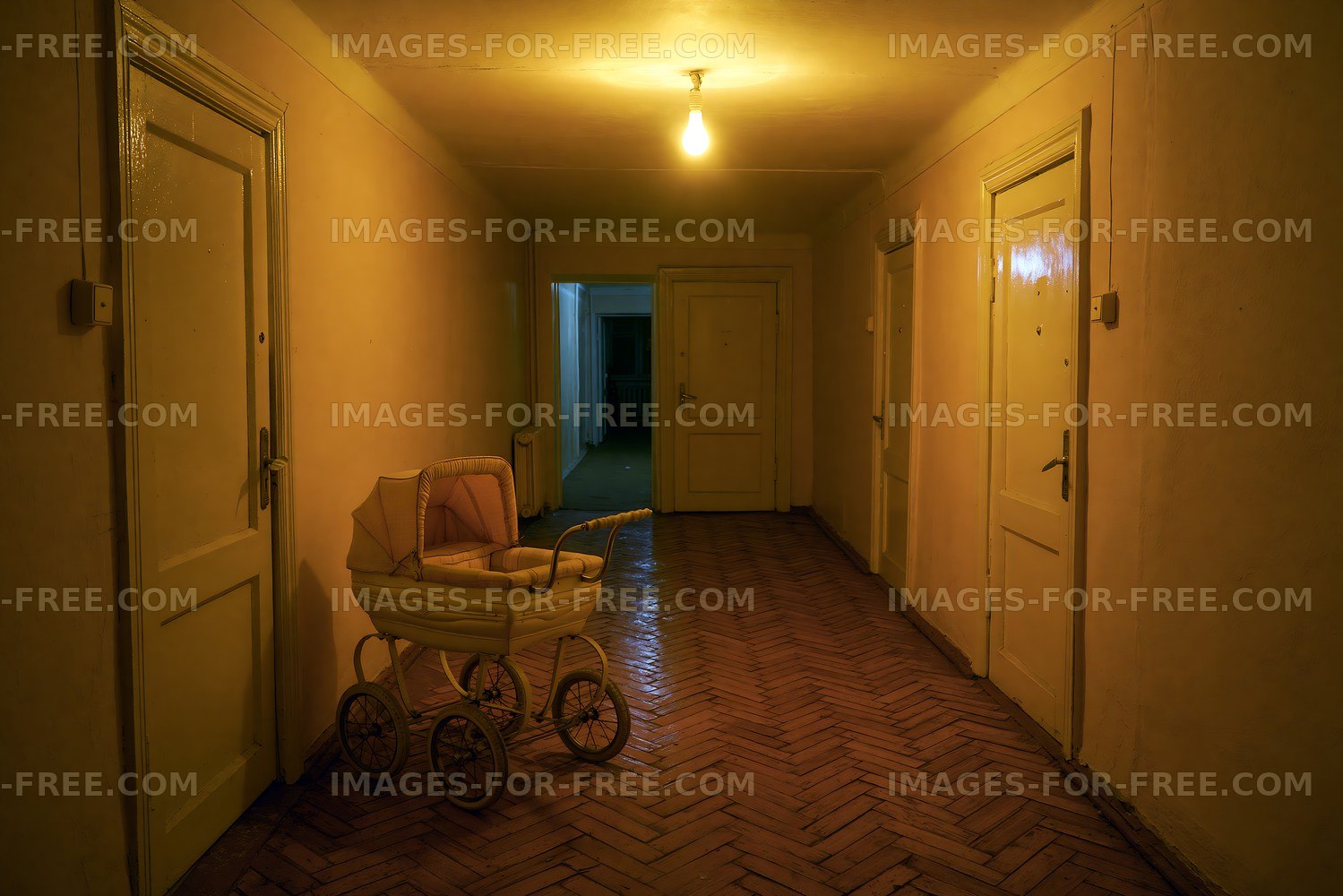 Empty hallway with a vintage baby carriage during low light
