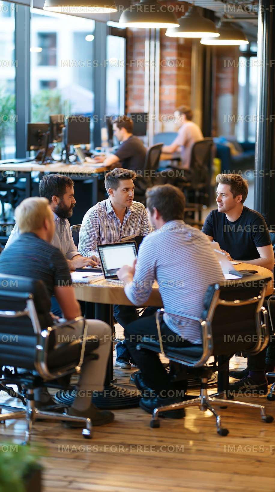 Group of people in a modern office discussing plans