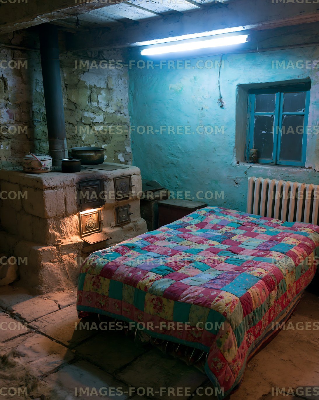Cozy interior of a rustic bedroom with a quilt and stone stove