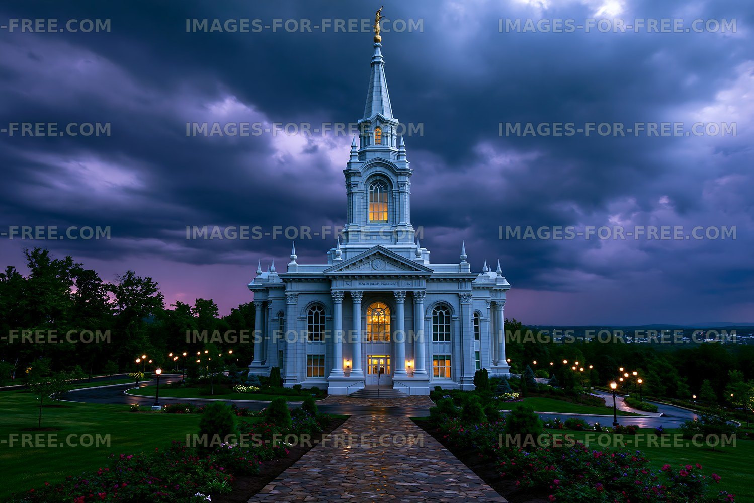 Building with tall spire under dark stormy sky at dusk