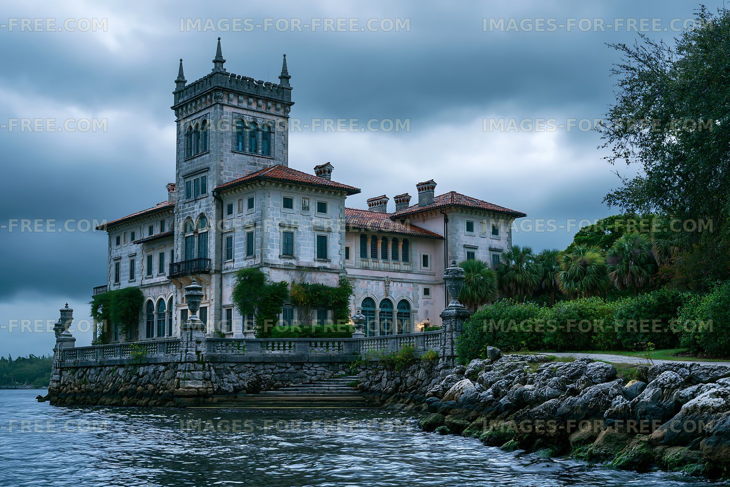 Historic mansion by the water under cloudy sky