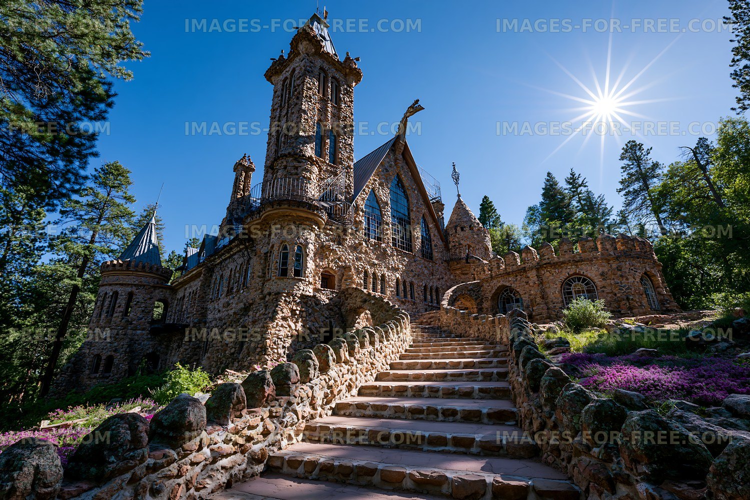 Majestic stone castle surrounded by trees and flowers