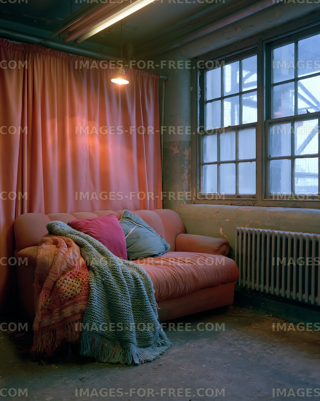 Living room with a sofa and decorative pillows near a window