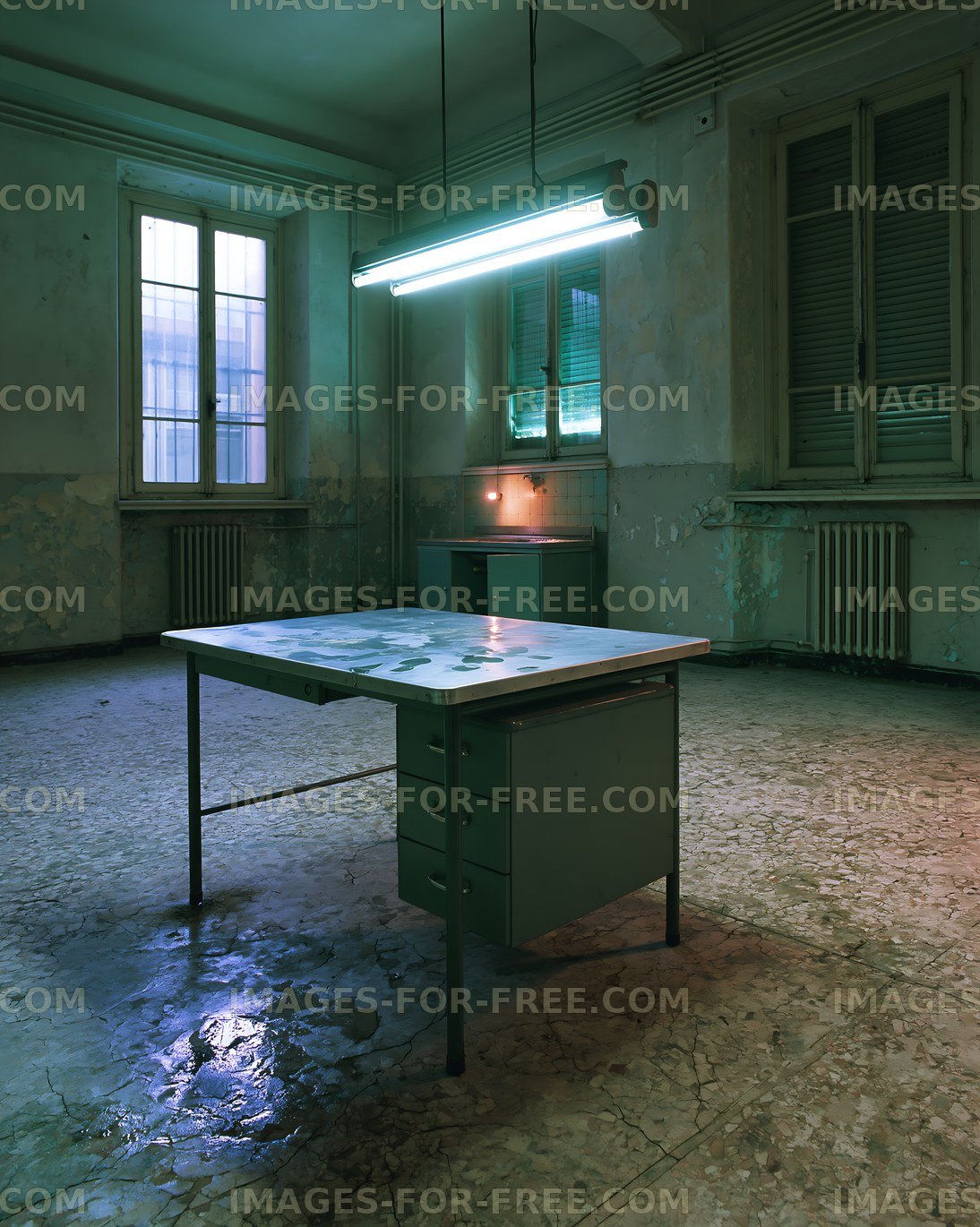 Old office space with a table and fluorescent lights