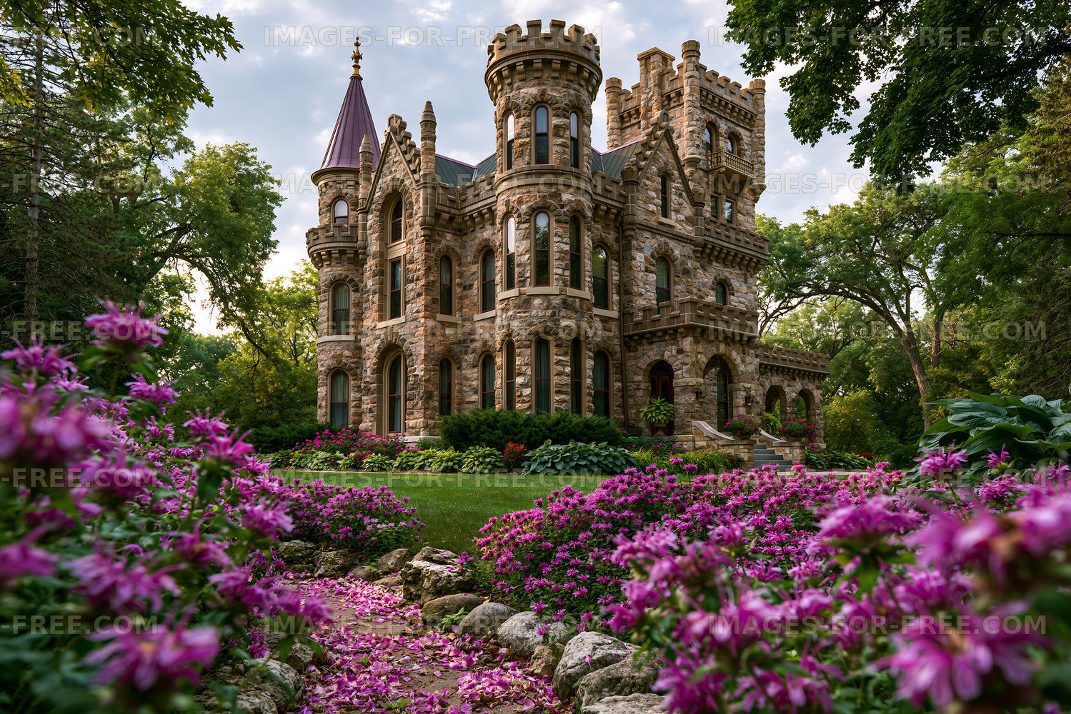 Historic castle surrounded by flowers in a garden