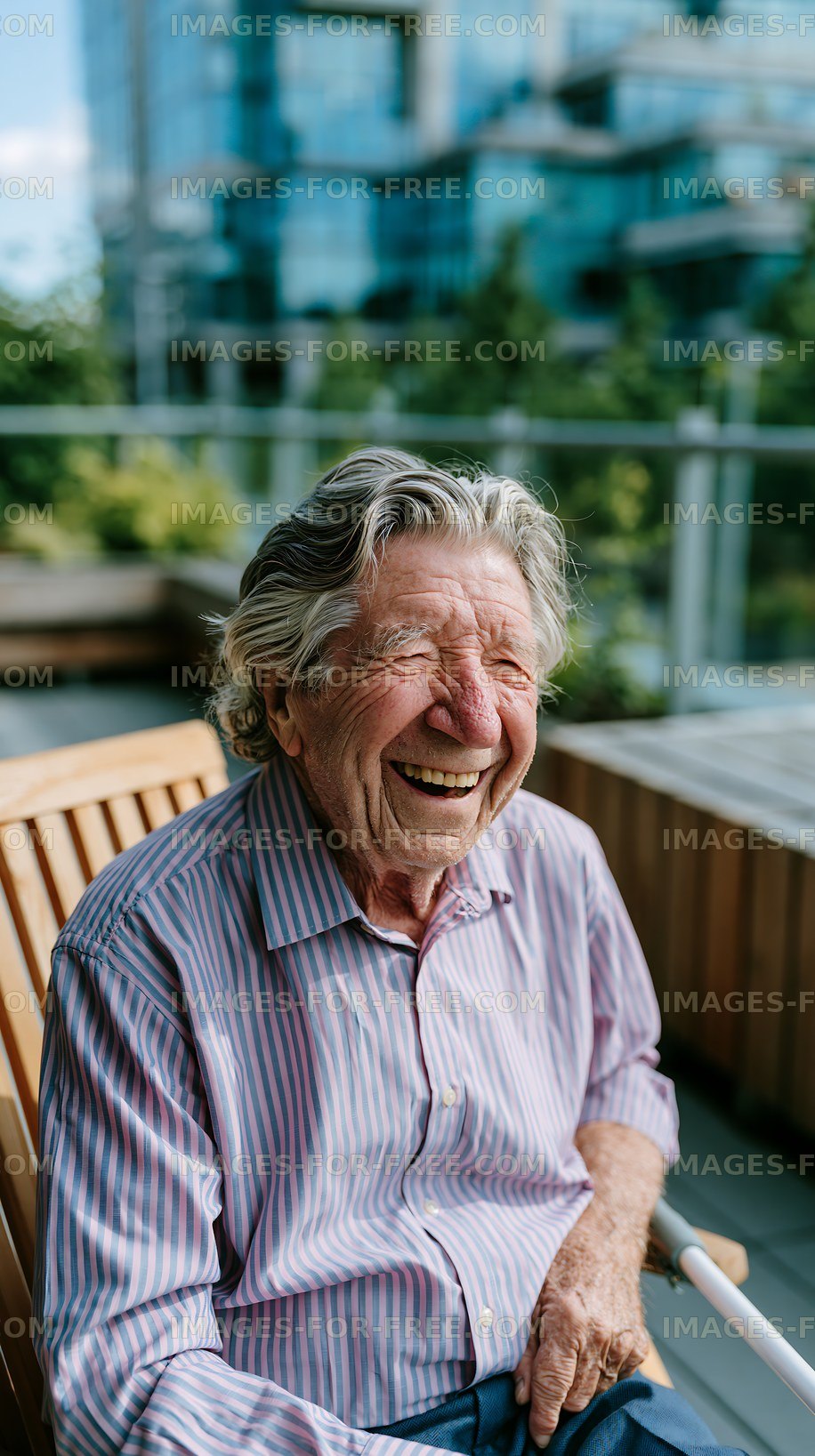 Older man smiles while sitting on a bench in outdoor setting