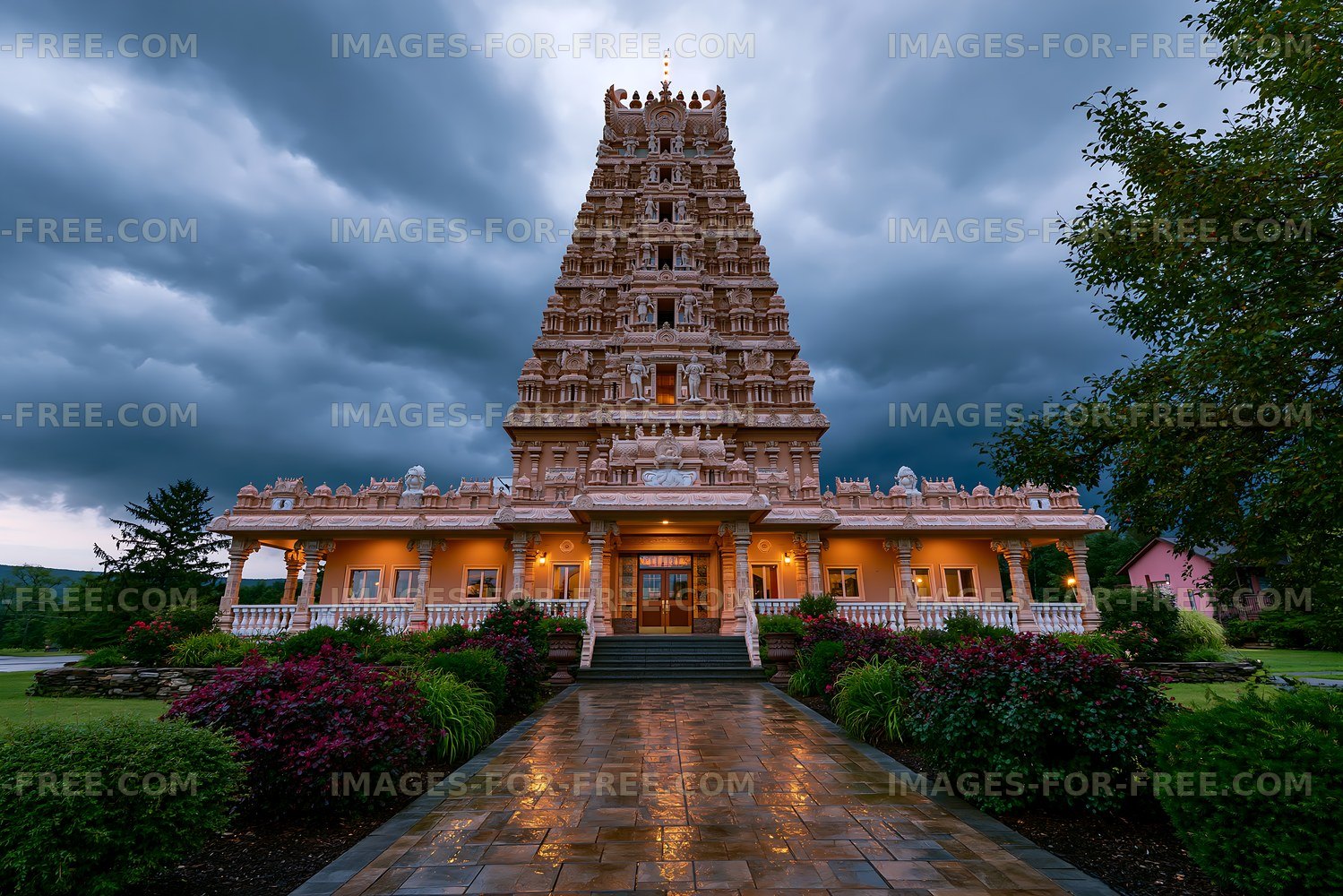 Cloudy sky above a Hindu temple with a detailed facade