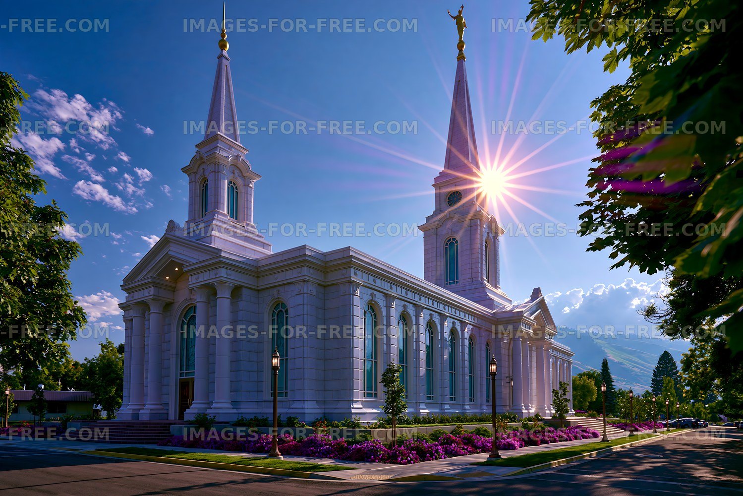 Sunlight shines on a white church building with tall spires