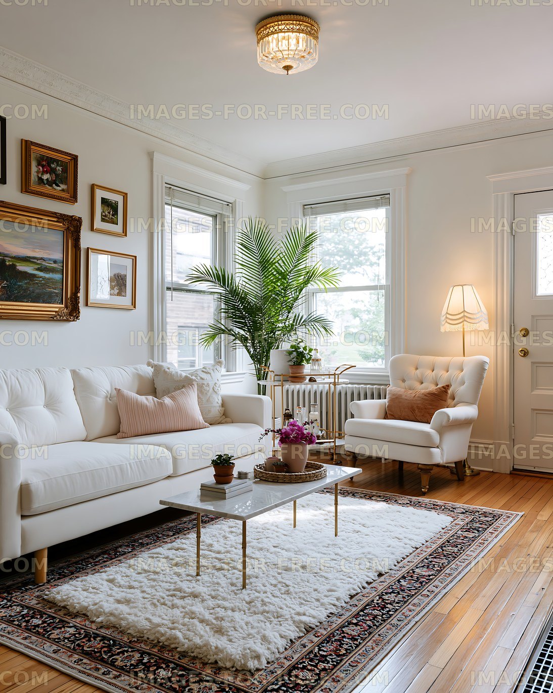 Bright living room with white furniture and large windows