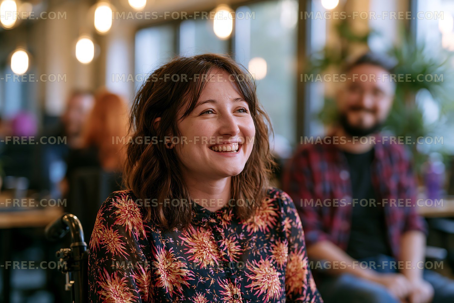 Smiling woman in a cafe with friends during a social gathering
