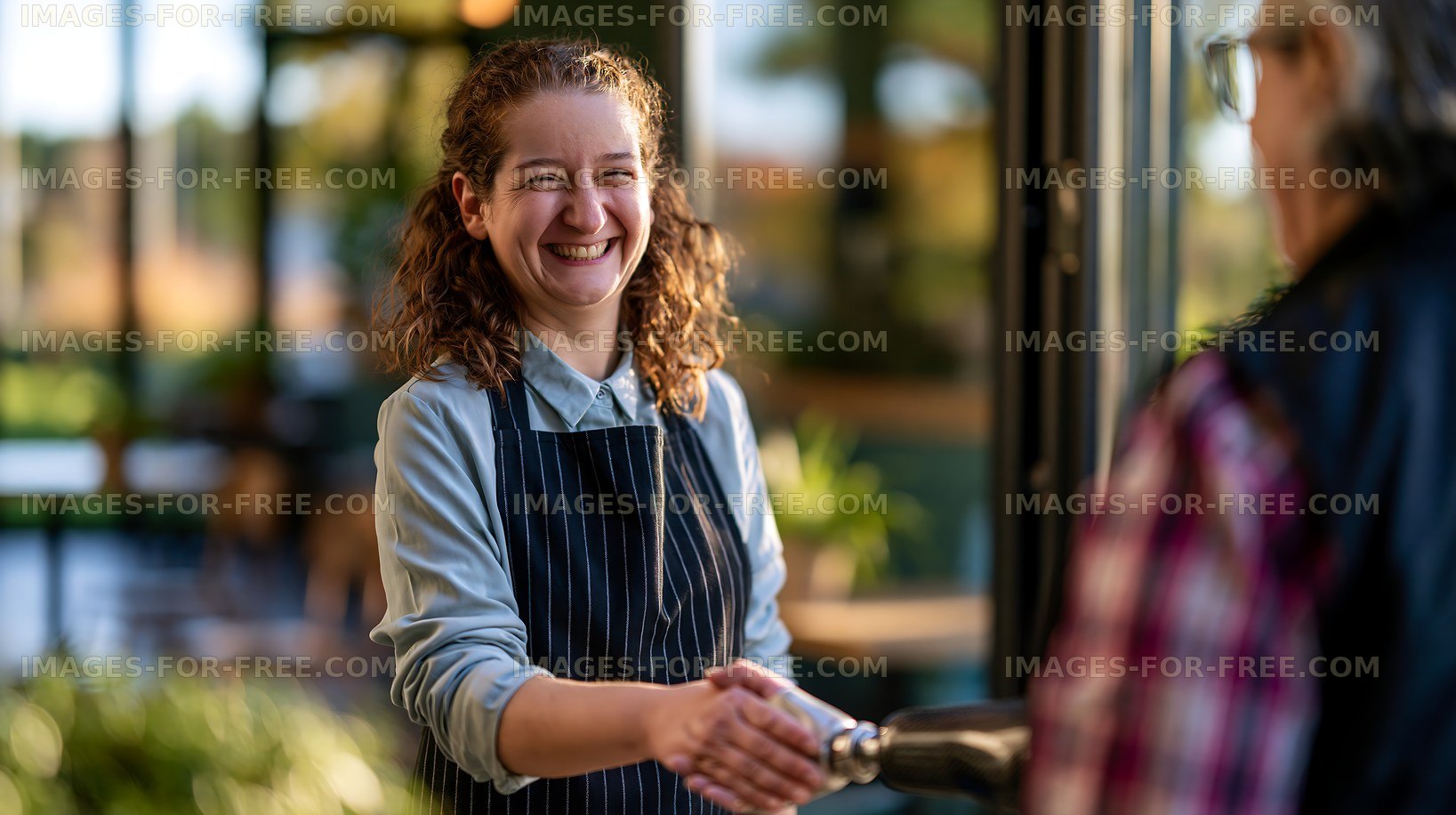 Employee welcomes customer at the entrance of a cafe
