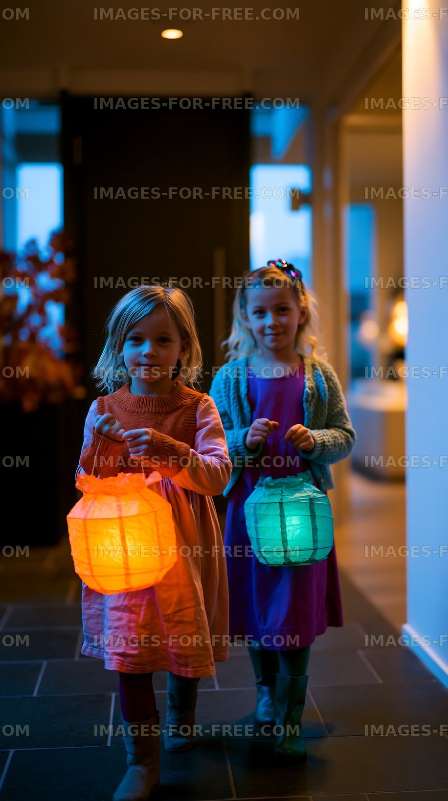 Children walking indoors at dusk holding glowing lanterns