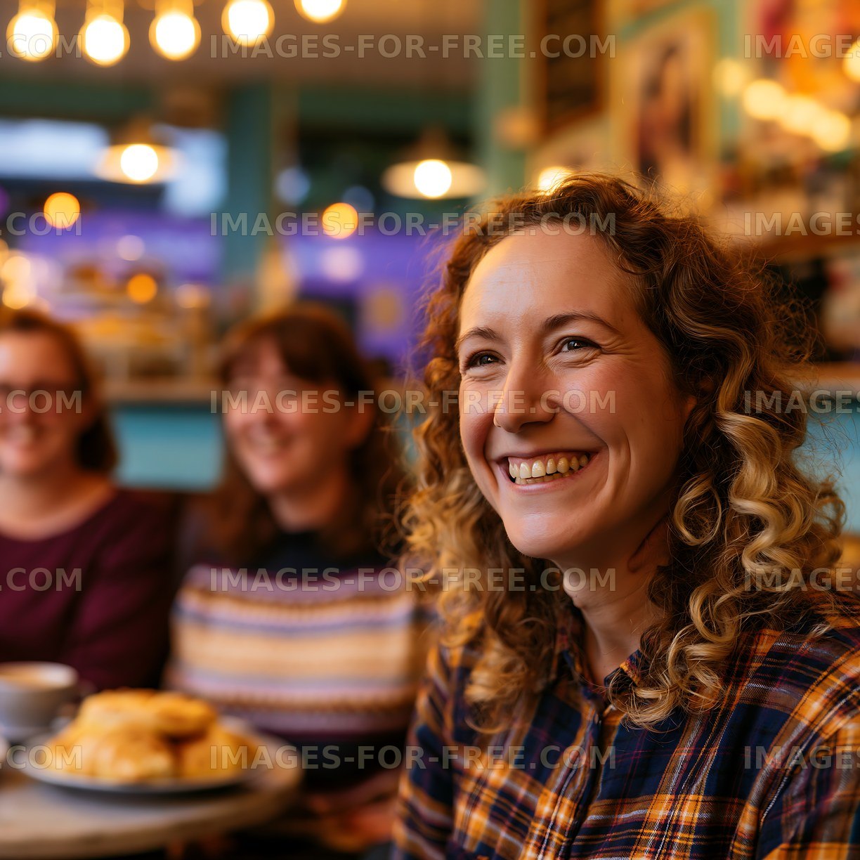 Friends enjoy coffee and pastries in a cafe setting