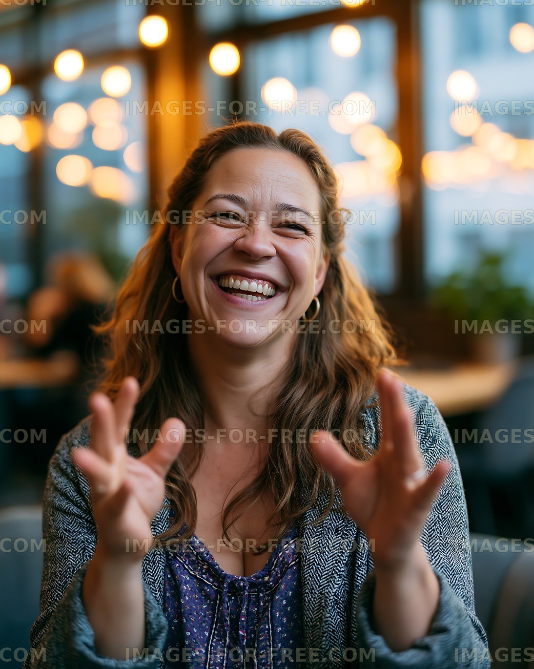 Woman smiling while interacting with friends in a cozy cafe