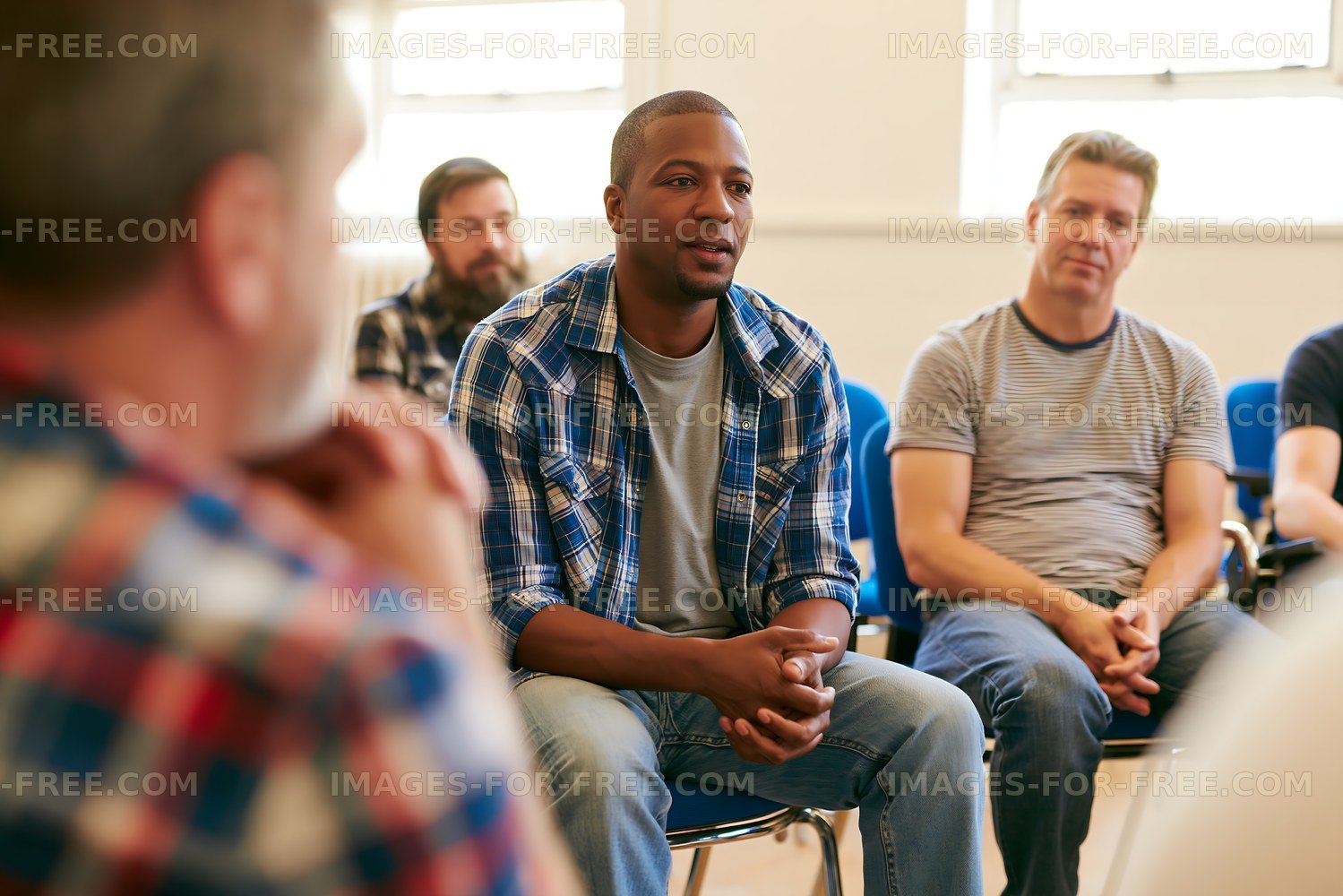 Group of men in discussion during a gathering indoors