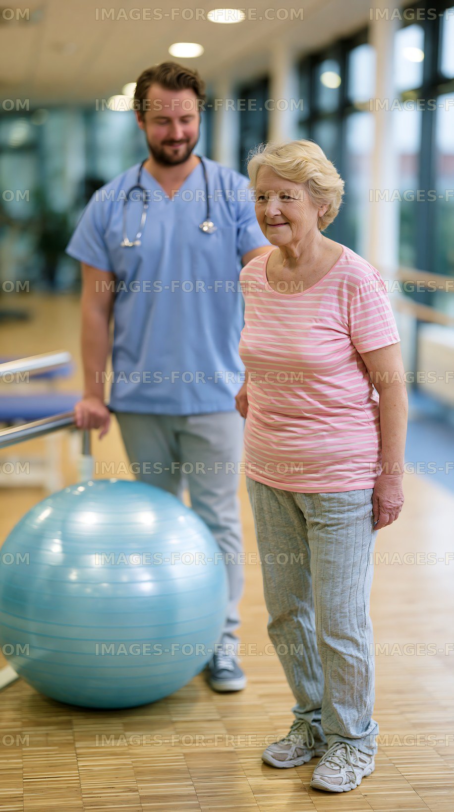 Therapist assists elderly woman during rehabilitation session