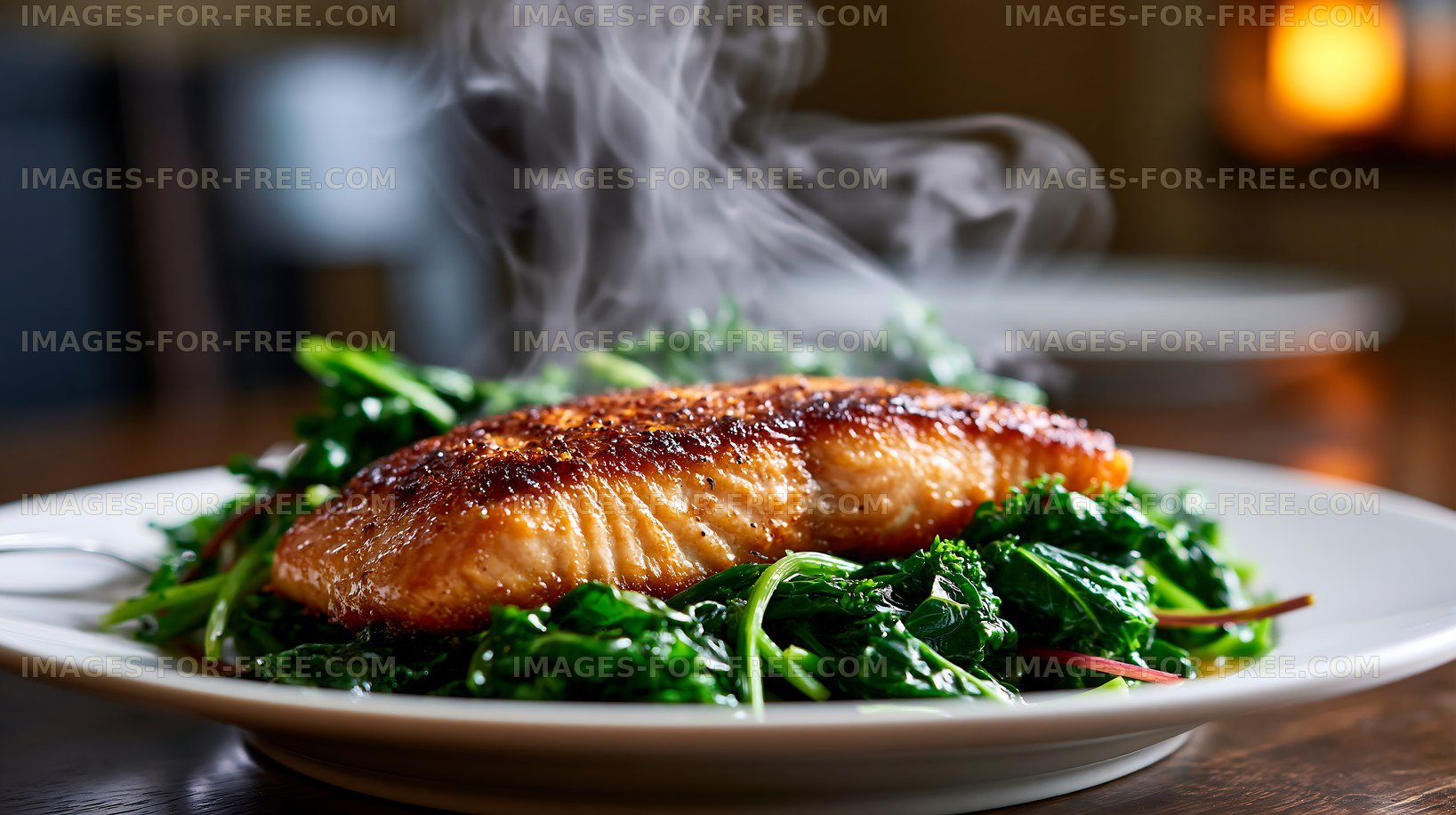 Salmon fillet served on a bed of greens with steam rising