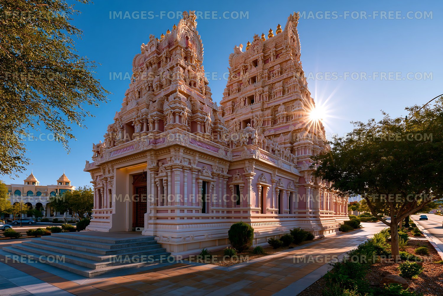 A Hindu temple features detailed carvings and tall spires