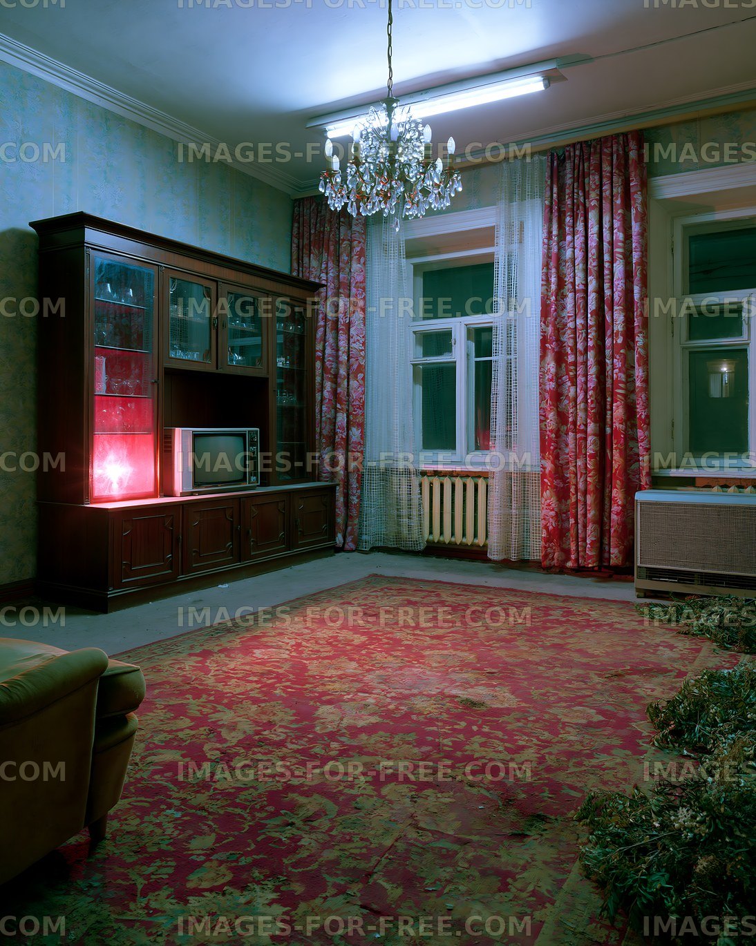 Old living room with vintage furniture and colorful curtains