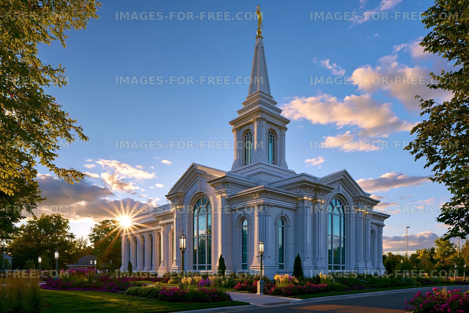 Church with a spire during sunset in a garden