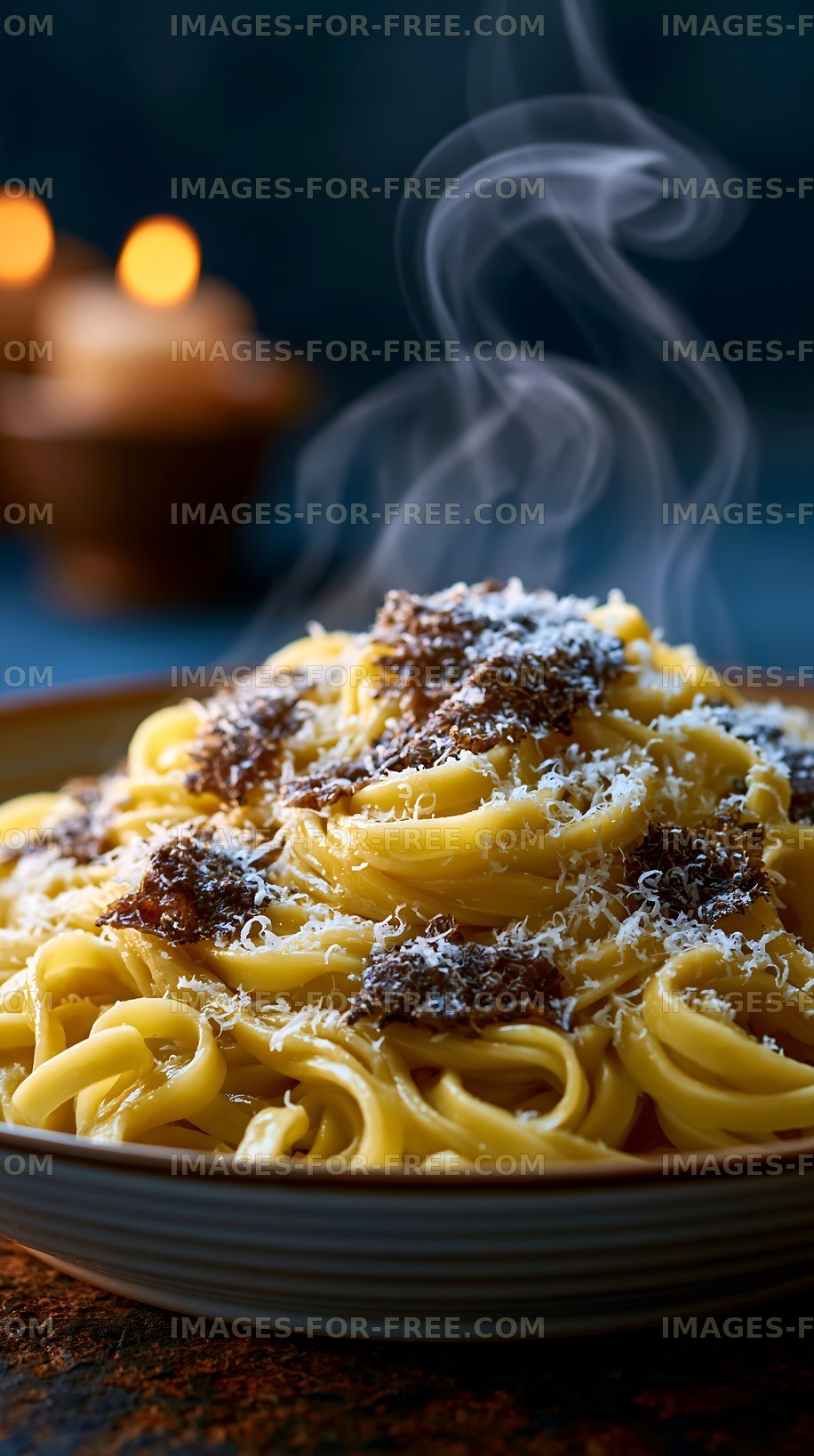 Pasta served with meat sauce and grated cheese on a plate