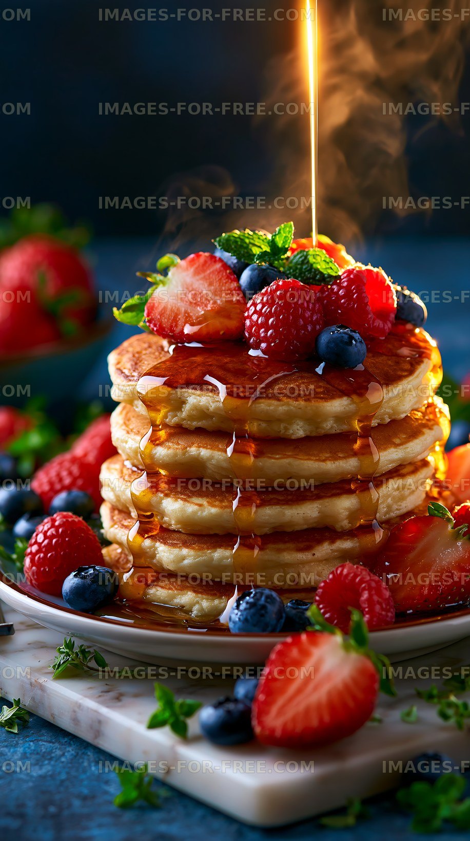 Pancakes stacked high with syrup and fresh berries