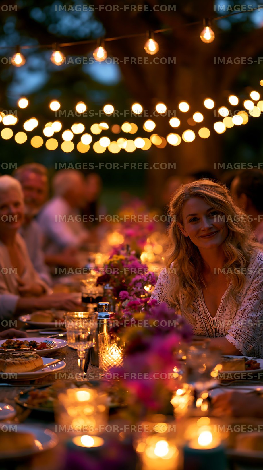 Gathering around the table at a festive outdoor dinner event