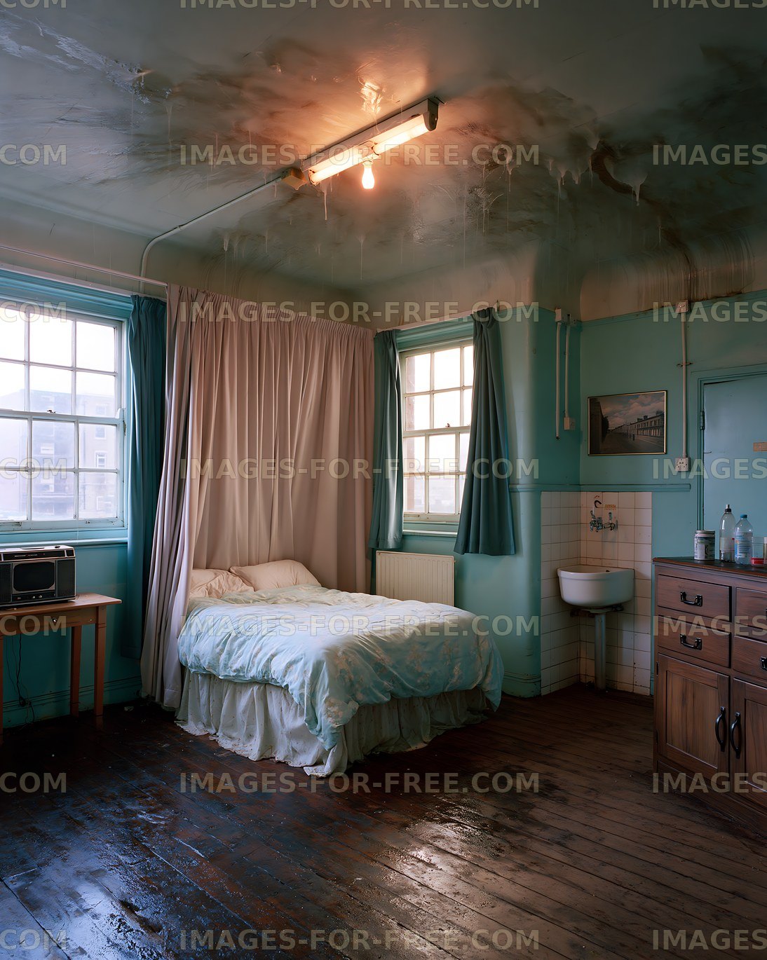 Room with a bed, window, and simple furnishings in urban setting